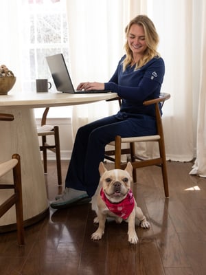 Dr. Kingsley issuing a client their domestic pet travel certificate after appointment.